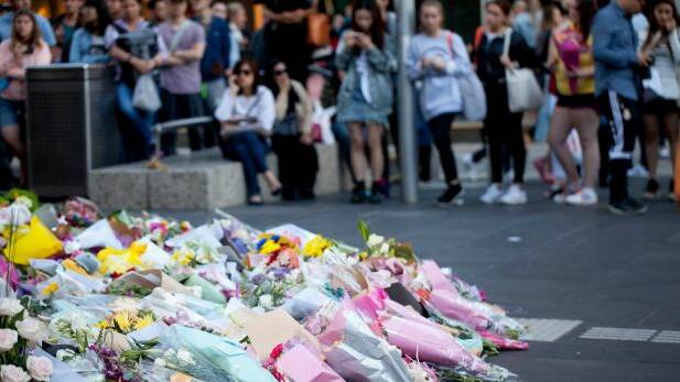 Mourners paid tribute to those killed in the Bourke Street Mall on Friday. Photo: Arsineh Houspian
