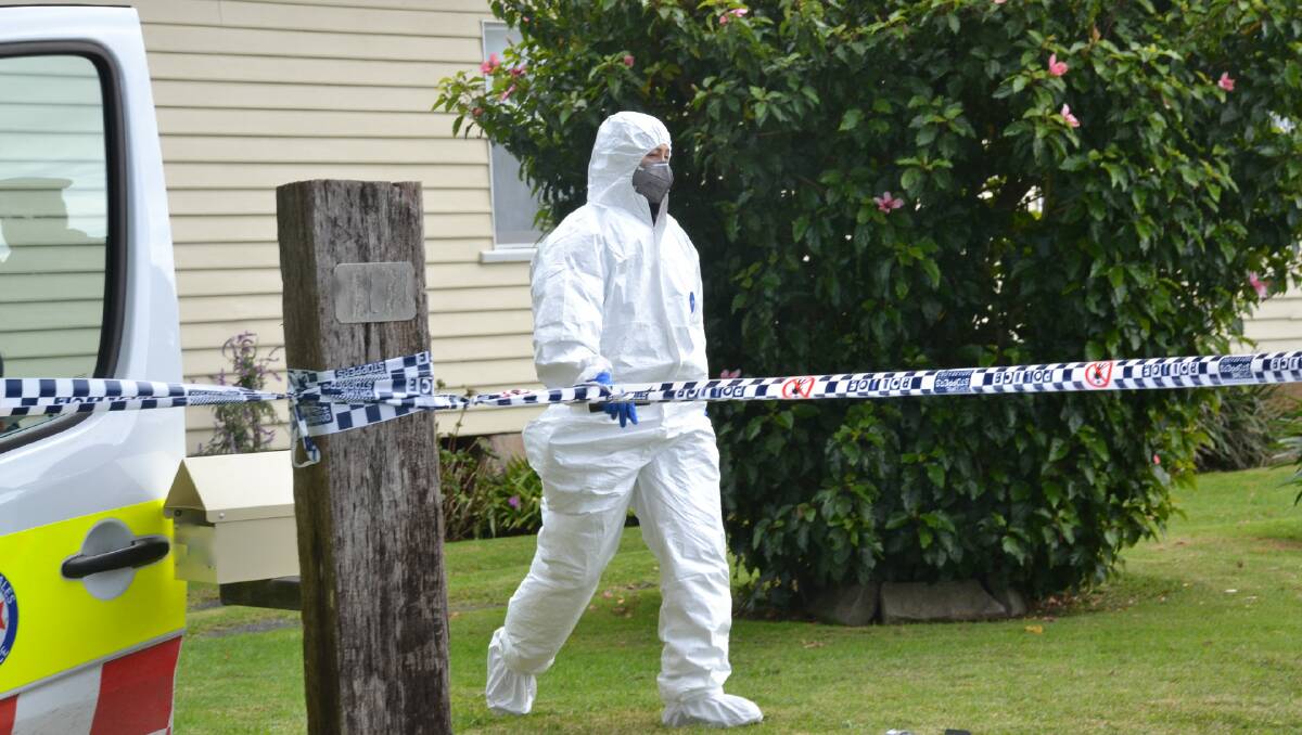 Forensic officers at the home in Numbaa.