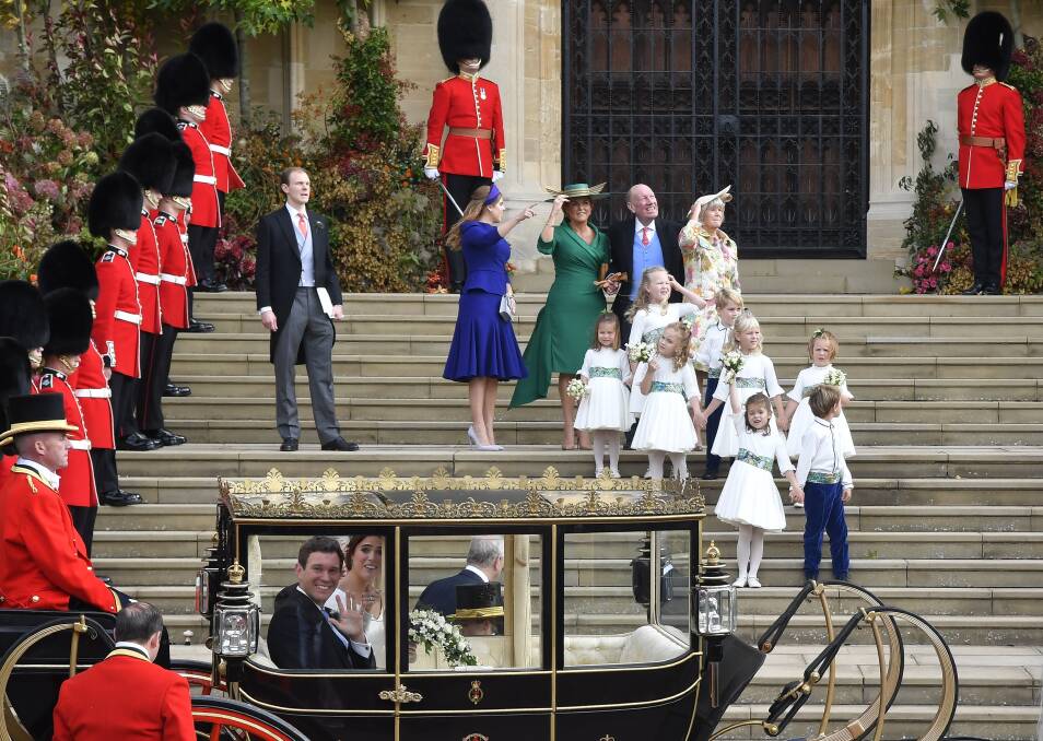 Britain's Princess Eugenie and Jack Brooksbank leave St George's Chapel after their wedding. Photo: Toby Melville/AP