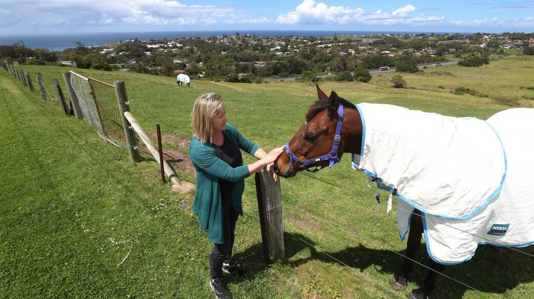 Kiama councillor Jodi Keast and friend on the boundary of the land proposed for rezoning under the plan now being reviewed.