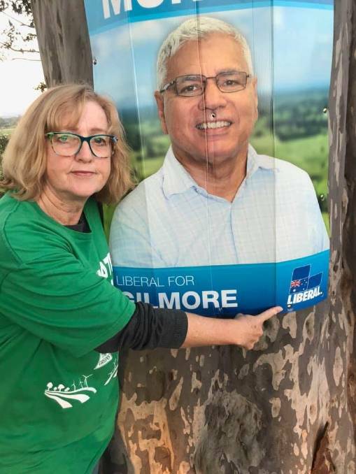 Greens Candidate for Gilmore raises awareness about Warren Mundine's signs along Moss Vale Road, Cambewarra.