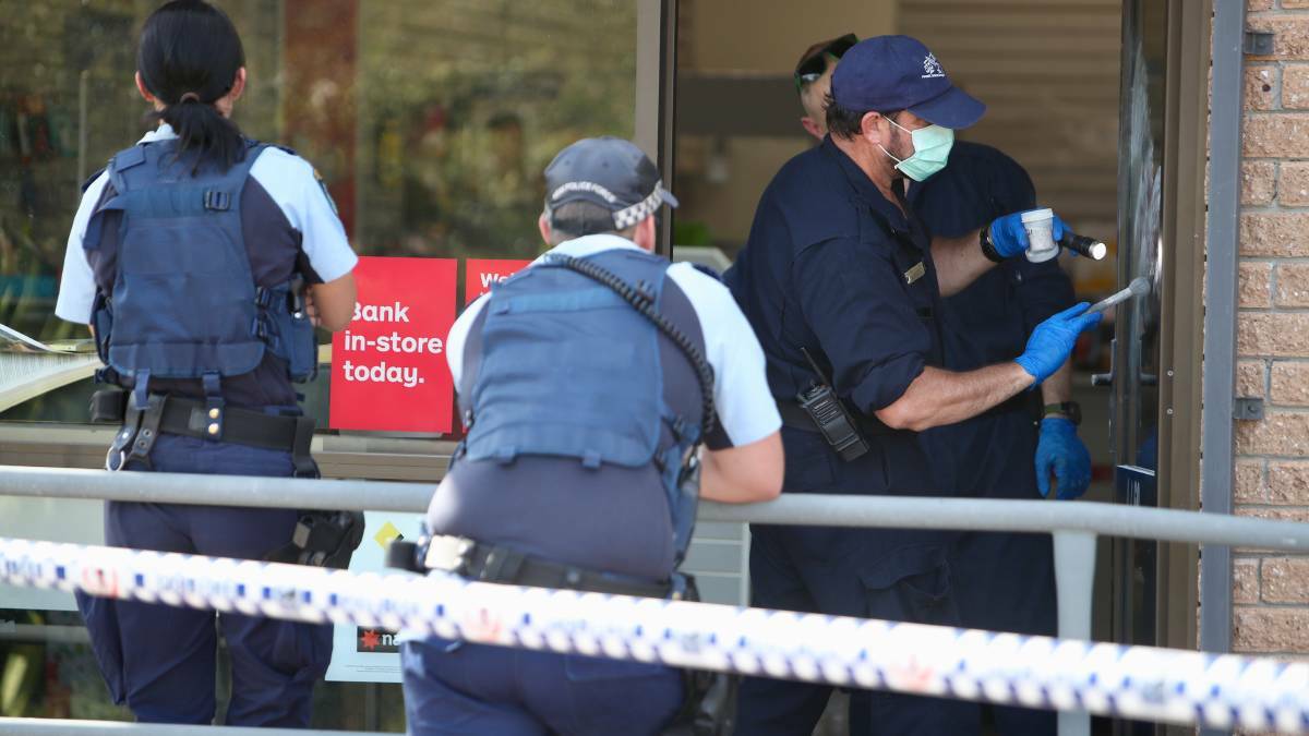 Forensics police collected evidence at the post office on Tuesday. Picture: Adam McLean