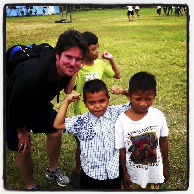 Mascord at a Filipino orphanage in 2013. He has worked in radio, television and print media and hosts his own podcast, White Line Fever. 