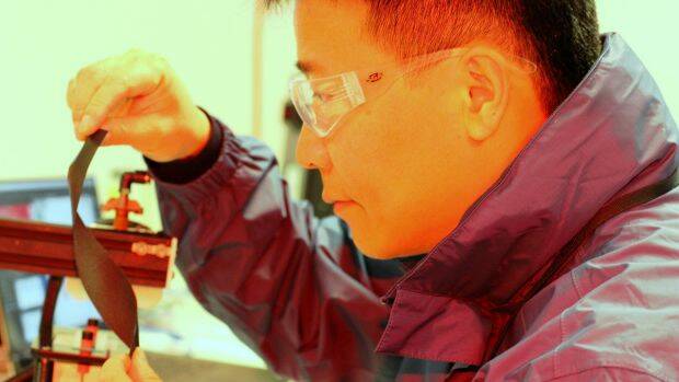 Early days: Professor Jun Chen with the new, flexible smart technology fabric. 
