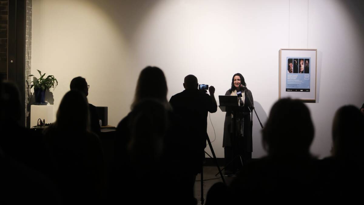 One of the subjects of the exhibition Melissa Edwards shares her personal story with the crowd at the launch. Pictures: Adam McLean.