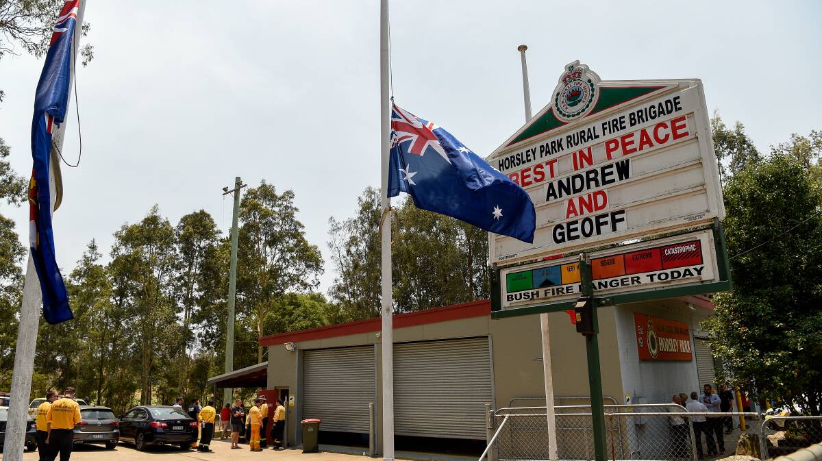 A memorial message for firefighters Andrew O'Dwyer and Geoffrey Keaton is seen on signage at the Horsley Park Rural Fire Brigade. Photo: AAP