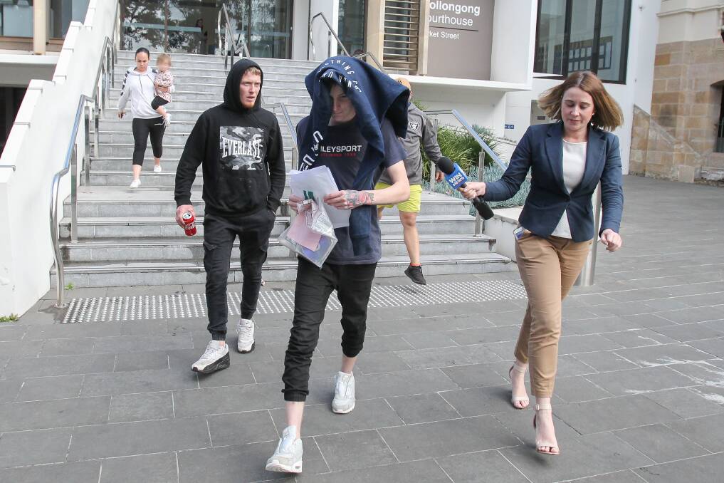 Cory Milgate, centre, leaving Wollongong court on Tuesday. 