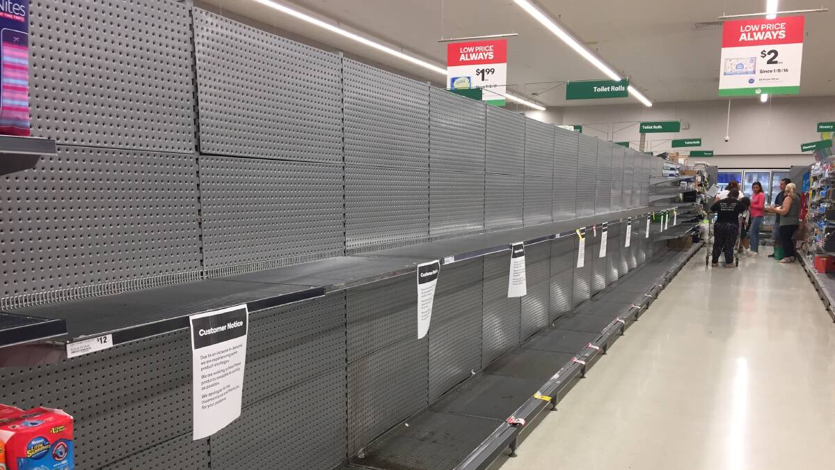 Shelves are bare at Woolworths in Unanderra. Photo: Adam McLean