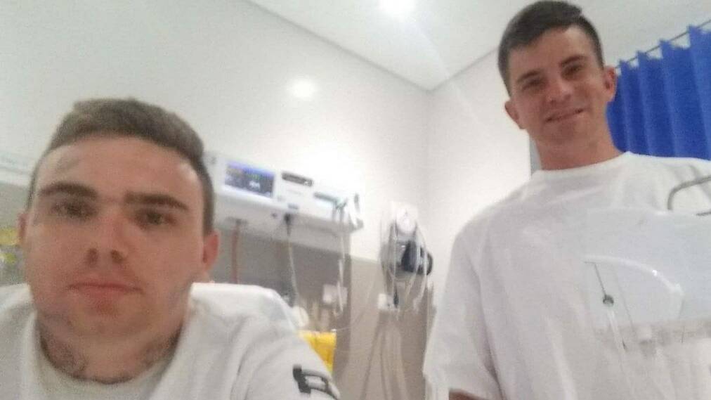 Daniel Merrett pictured in hospital with his friend Joe Louis.