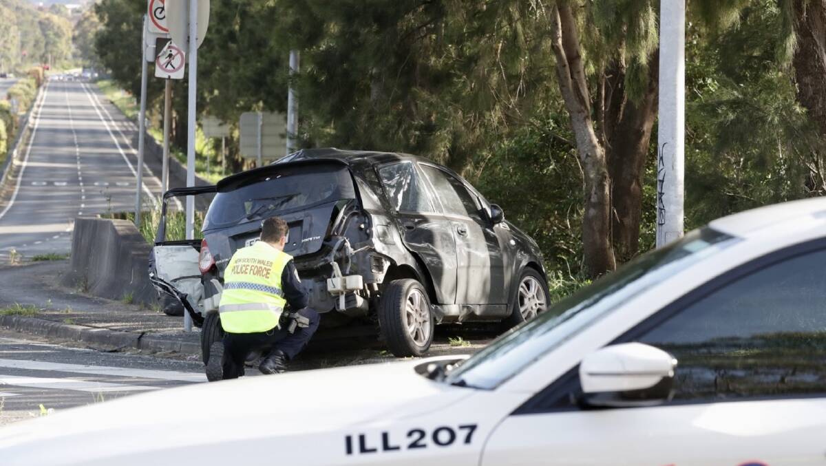 The wreckage of a Holden Barina at the intersection of Memorial Drive and Towradgi Road. Pictures by Adam McLean 