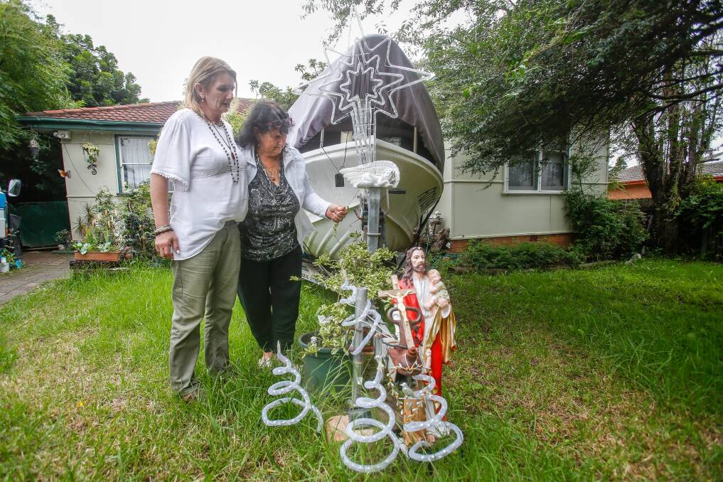 Kathy McWatters, pictured with Jye's mother, Sonia McWatters (left), keeps a star lit up on her front lawn day and night to mark the place where Jye's body was found. Picture: Adam McLean