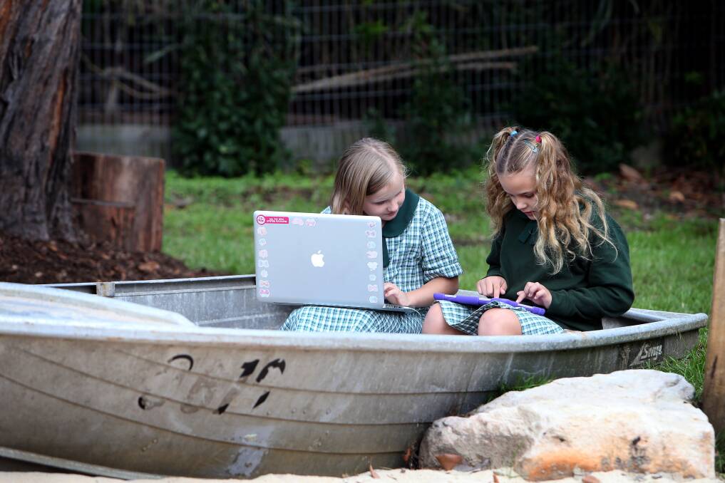 Mount Ousley Public students at work in the school's new Outdoor Learning Area. 