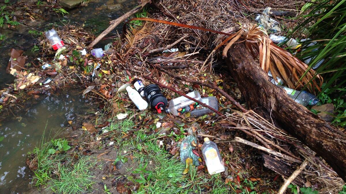 This kind of plastic pollution, spotted on Cordeaux Rd at Cordeaux Heights, is standard after heavy rains, showing the extent of littering. 