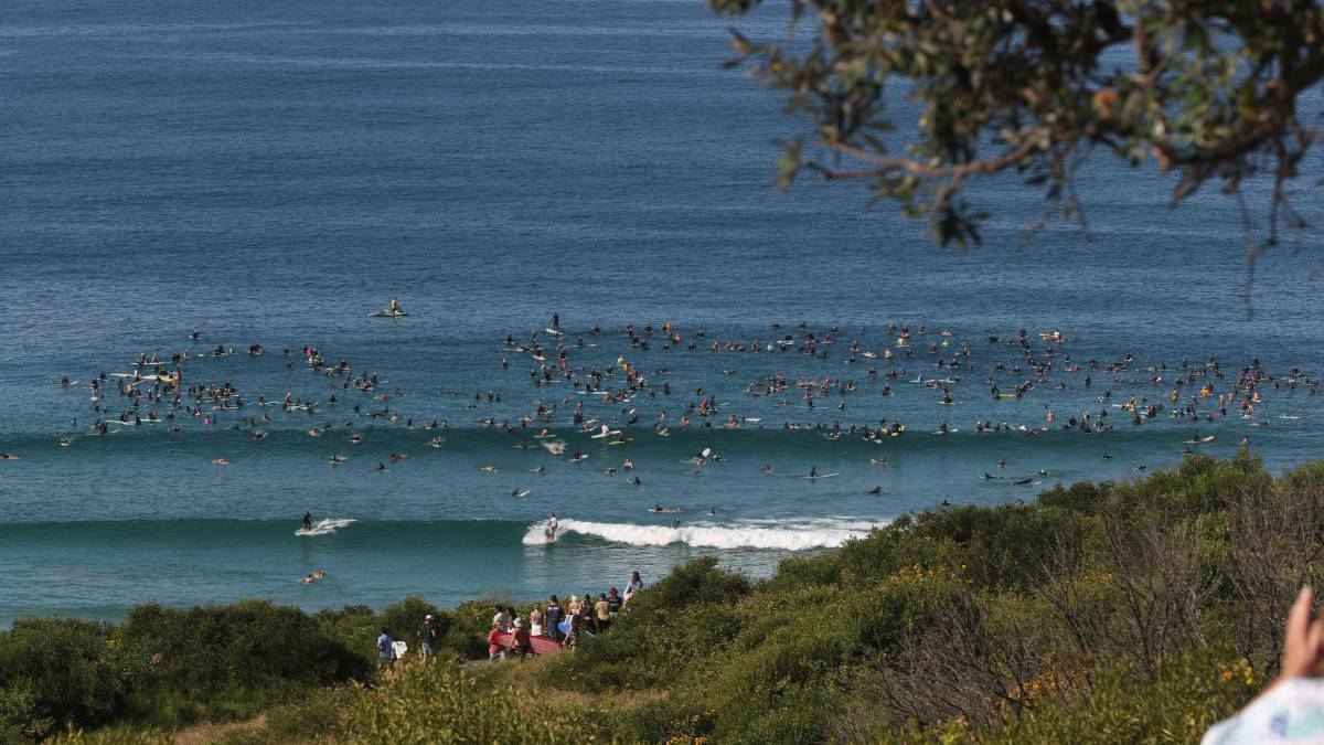 Hundreds took part in a paddle out and protest at The Farm in May. Photo: Robert Peet