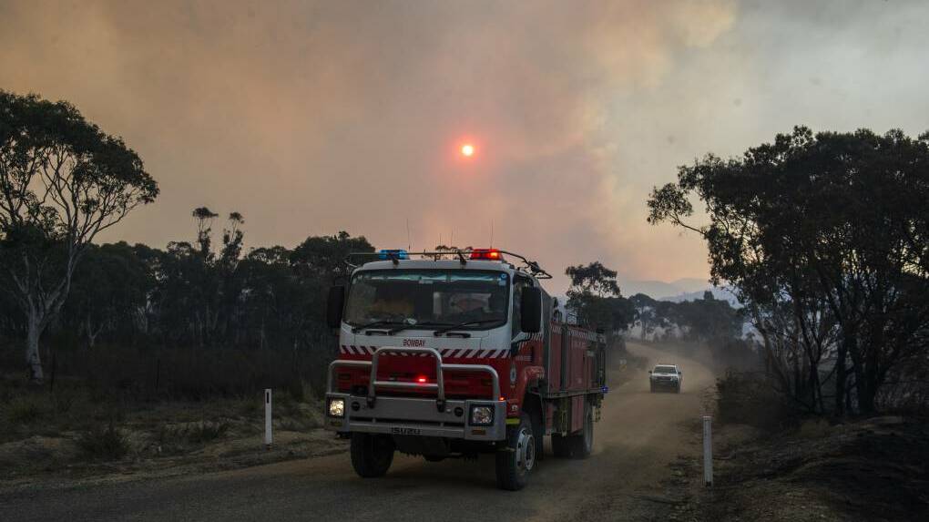 Fire trucks patrolled Bombay, NSW on Saturday evening for spot fires caused by the North Black Range bushfire. Picture: Dion Georgopoulos 