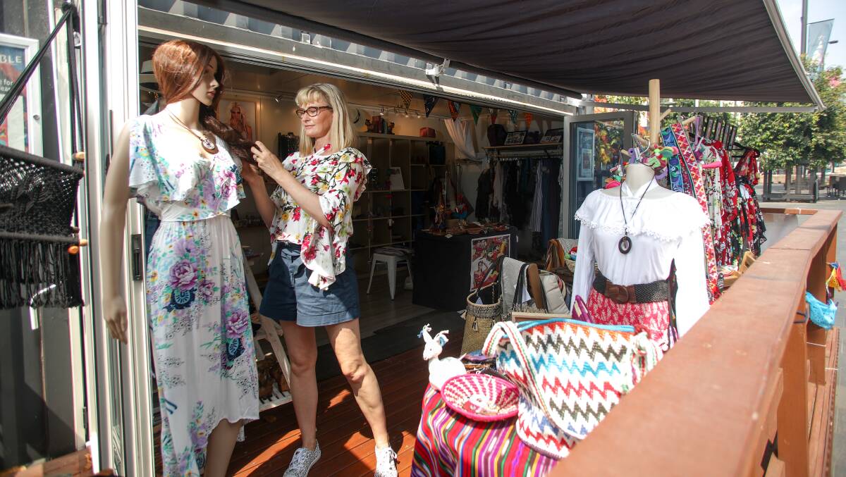 Fashion designer Anna Stacey is running a fair trade market from the container pop-up in Crown Street Mall. Photo: Adam McLean