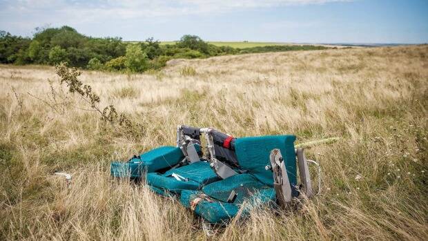 A row of seats from Malaysia Airlines flight MH17 lie in the Ukrainian field. Picture: Getty Images