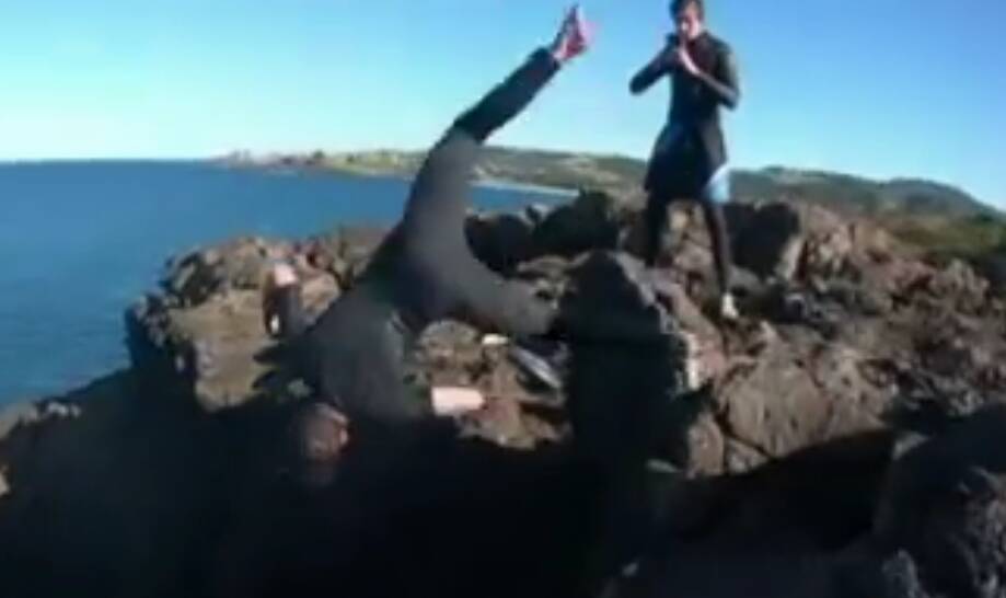 Stills from footage taken by Sydney teens' whose dangerous stunt at Kiama Blowhole sparked an emergency services rescue operation. Picture: Seven News