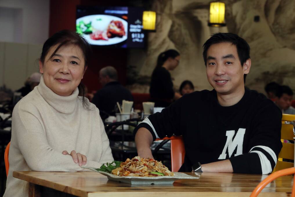 Food World Gourmet Cafe co-owner Michael Li with former owner Yen Phan. Photo: Robert Peet