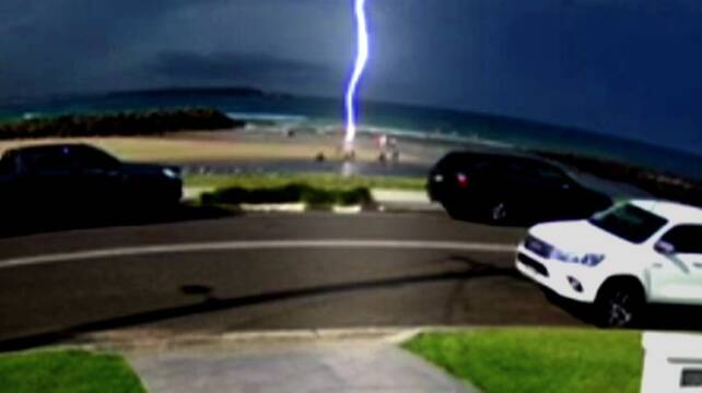 The moment the lightning struck at the Warilla beach. Picture by 9News