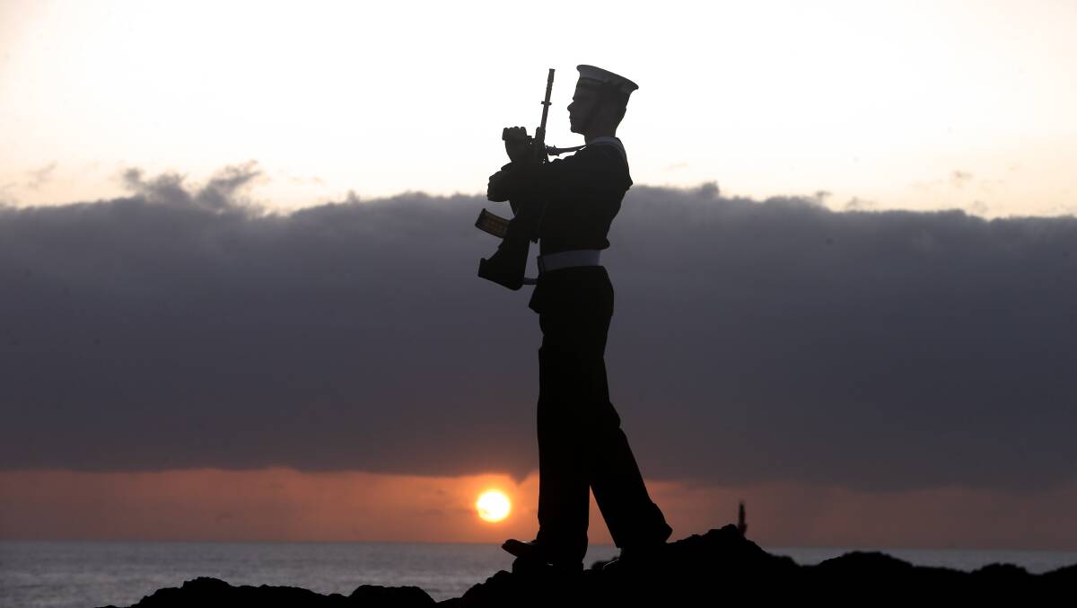 A guard member stands at attention at last year's dawn service at Blowhole Point in Kiama.