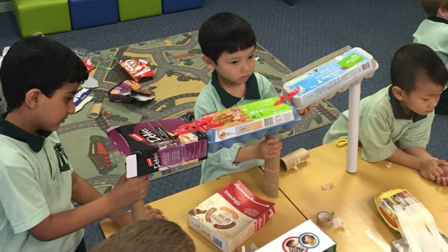 Young students build bridges in the Maker Space.