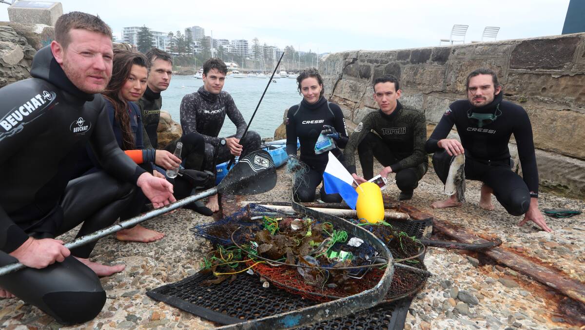 Dohring (third from right) and other Wollongong free divers will take part in a massive cleanup of Wollongong Harbour next month.