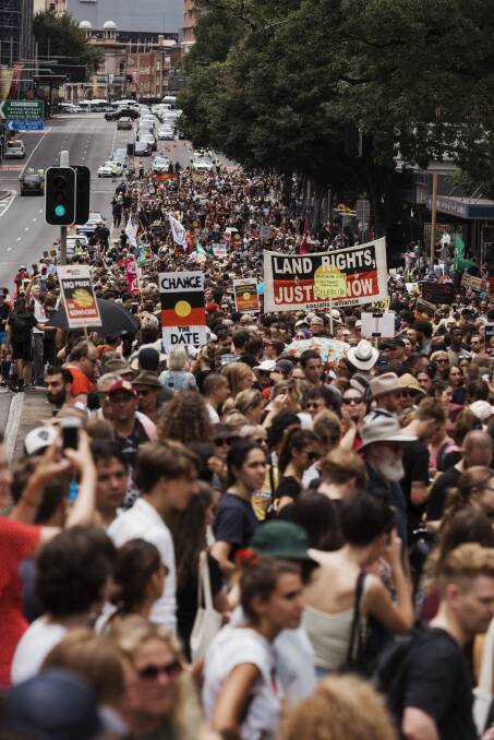 Marchers gather for the Invasion Day rally at The Block in Redfern.  Photo: James Brickwood
