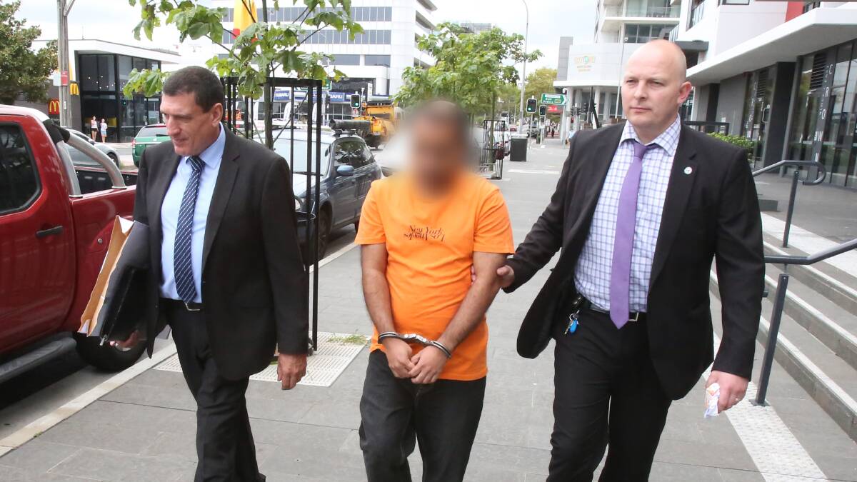 Detectives from the child abuse squad escort Kulkarni to Wollongong Police Station on Friday. Police: NSW Police