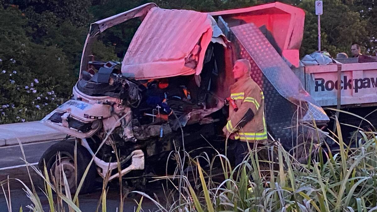A firefighter at the scene of a truck crash on Princes Highway near Bomaderry on Thursday, December 7, 2023. Picture by Glenn Ellard