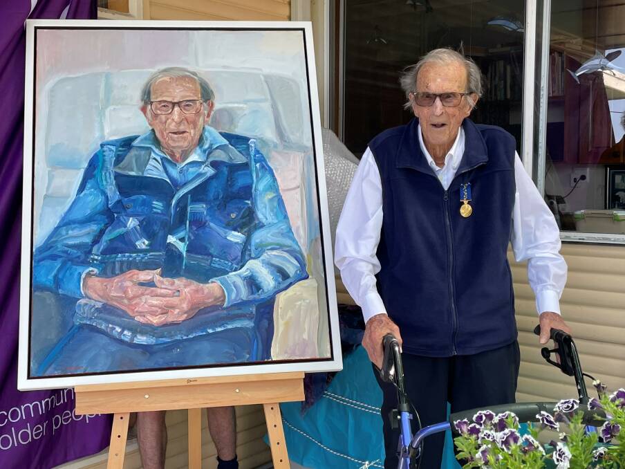 HONOURED: Warrigal founder Norm Rowland stands next to his portrait, painted by 2021 Archibald Prize winner Peter Wegner. Picture: supplied