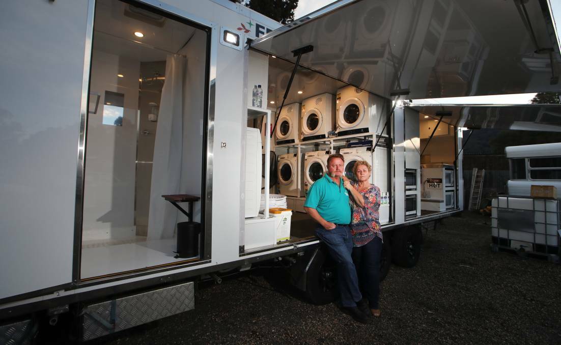 Bellambi volunteers Hamilton and Susan Gervaise with their Fresh Start trailer. Picture: Sylvia Liber.