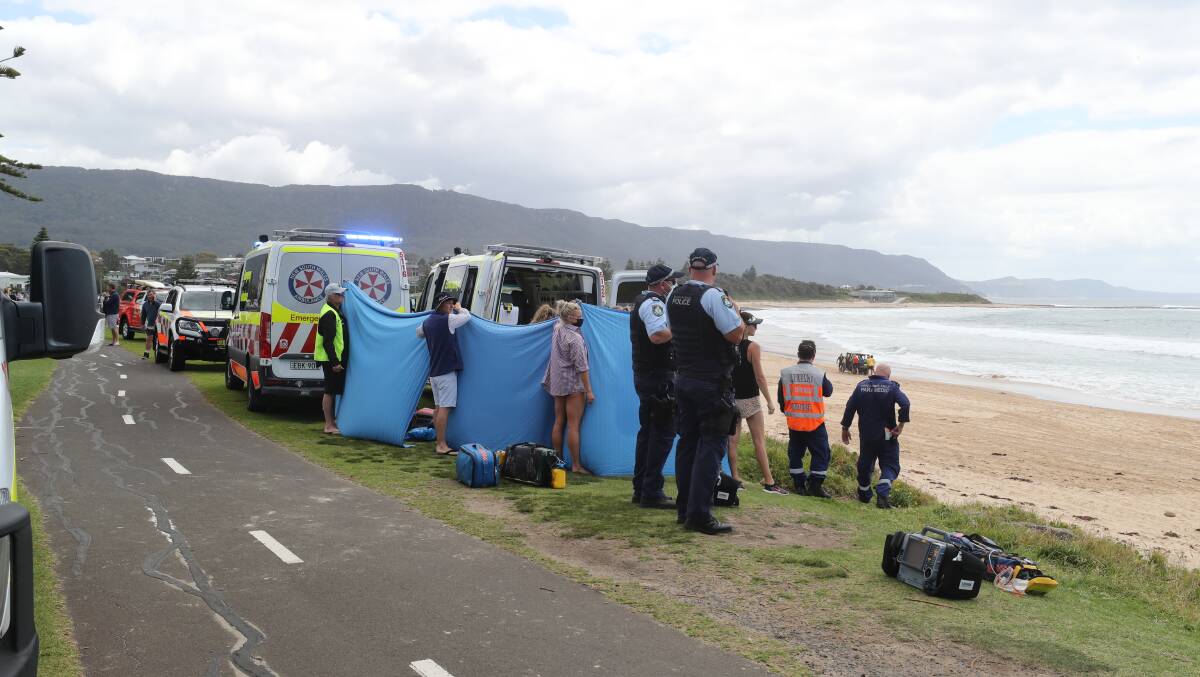 MASS RESCUE: Seven people were pulled from the water on Sunday, four unconscious. One man died, three remain in hospital. Picture: Robert Peet.