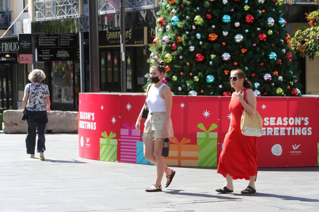Masks and QR codes are no longer required for many venues, but many Wollongong shoppers and businesses are concerned about the potential consequences. Picture: Sylvia Liber.