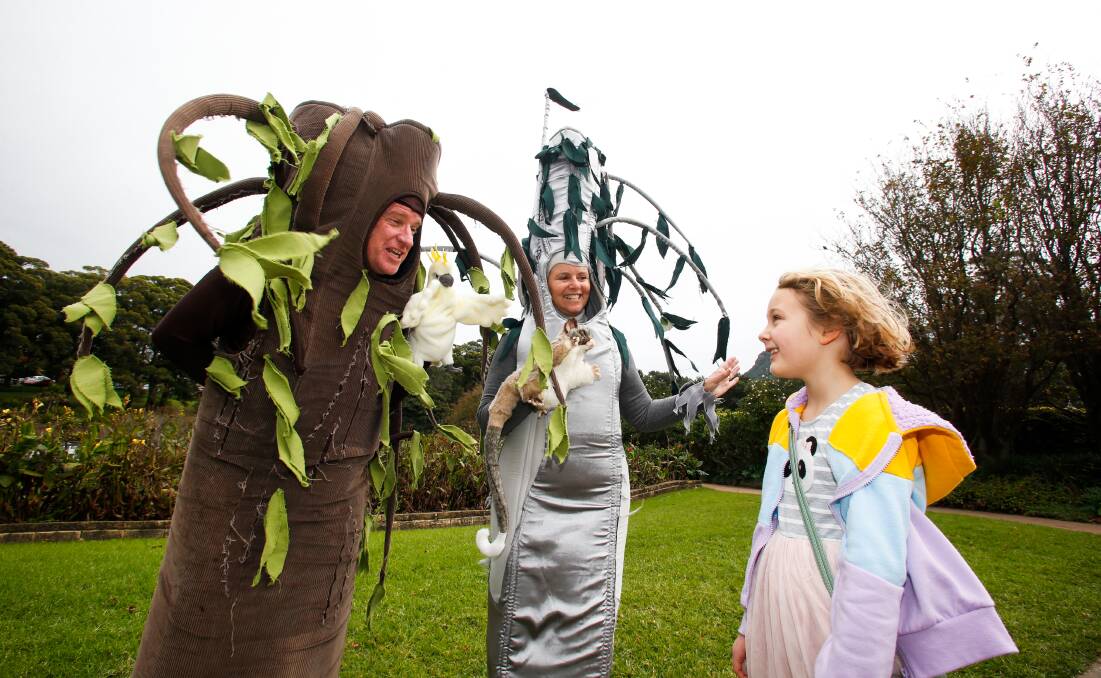 Plant yourself: Seven-year-old Orla Muldoon is greeted by talking trees at the Wollongong Botanic Gardens. Picture: Anna Warr