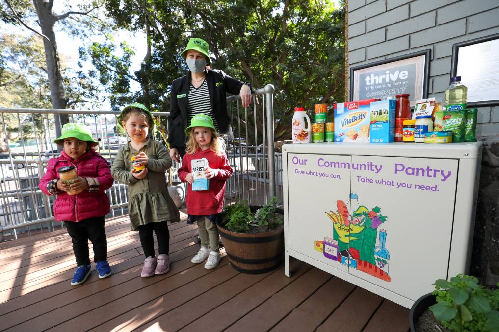 GIVE BACK: Lara Elregily, Adalyn Manglesdorf, Shiloh Levoune all aged three with director Ganelle Grey at the Coniston Thrive Community Pantry. Picture: Adam McLean.