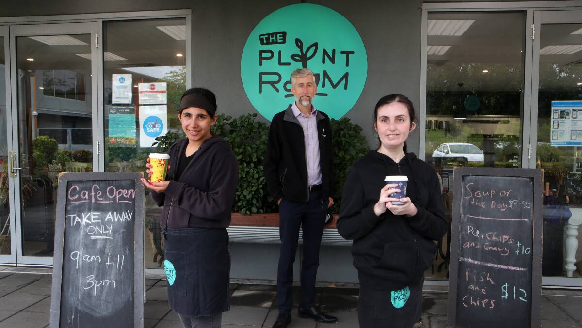 TEAM WORK: Edward Birt of the Disability Trust with employees Mel Pennimpede and Amy McGuire in front of the Plant Room Cafe. Picture: Sylvia Liber.