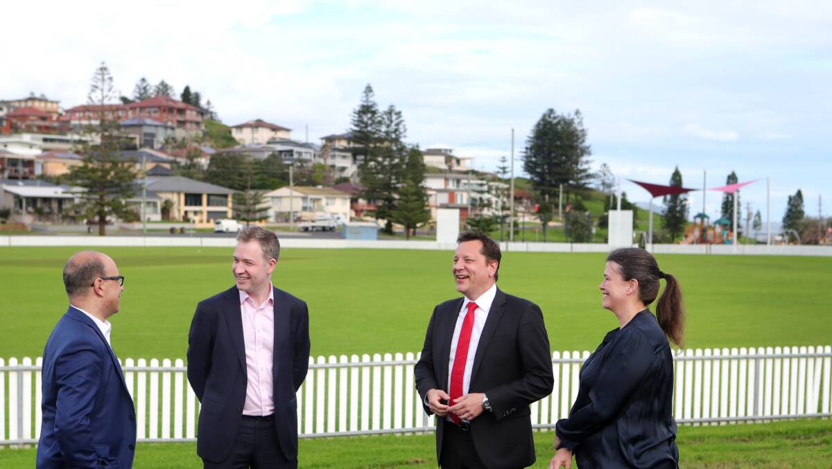 Peter Poulos-Parliamentary secretary for Wollongong and Illawarra, Adam Zarth, executive director Business Illawarra, MP Paul Scully and councillor Elisha Aitken at Port Kembla King George Oval inspecting projects funded under the previous round. Picture: Sylvia Liber. 