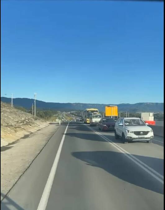 DELAYS: Traffic backed up at the Oak Flats interchange after the installation of traffic lights on June 7. It will be months before the Albion Park Rail bypass is opened. Image supplied.