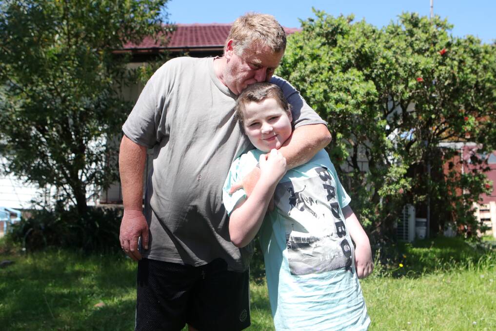DOUBLE-EDGED SWORD: Michael Kaehne with his son Jae-Jae who suffers from a heart condition, has mixed feelings about students' return to school. Picture: Sylvia Liber.
