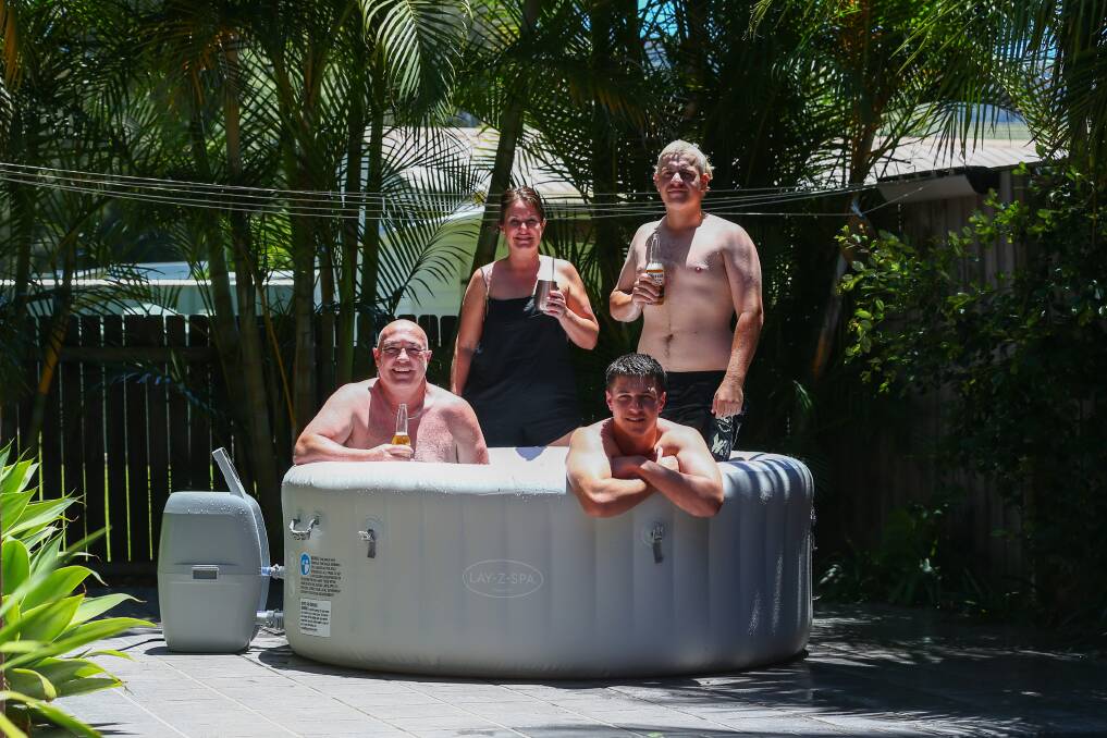 The Plecas/Muscat family from East Corrimal are prepared to celebrate New Year's Eve in isolationafter their son Tom Muscat tested COVID positive. Grant Plecas, Braith Plcas, Melanie Plecas and Sam Muscat. Picture: Wesley Lonergan. 