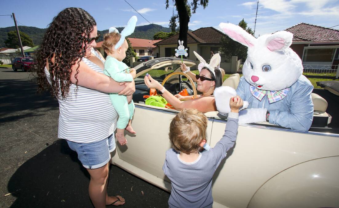 CELEBRITY SPOTTED: Sam and William Douglas greet the Easter Bunny on the Lawson Street leg of his Fairy Meadow tour. Photo: Anna Warr.