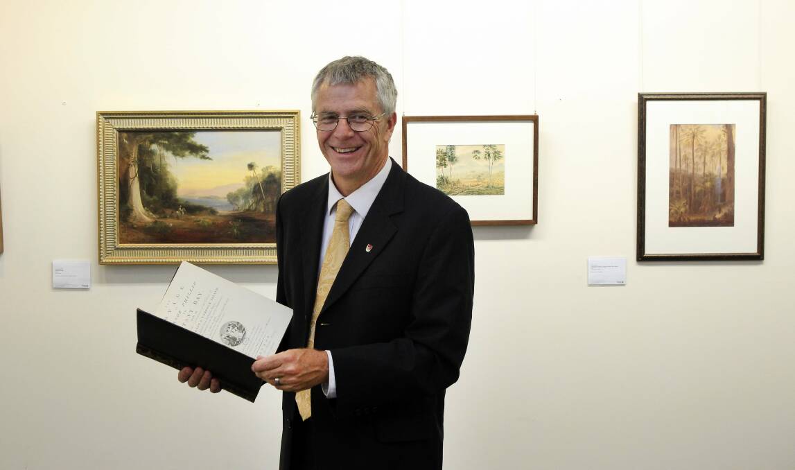 University of Wollongong archivist Michael Organ with a replica of the Voyage of Governor Phillip to Botany Bay, which was originally  published in 1789. Picture: ANDY ZAKELI