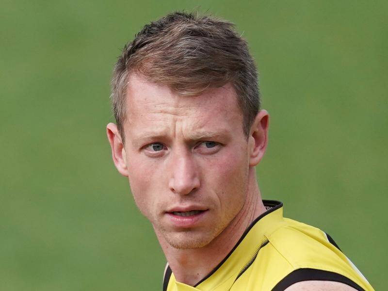 A Victorian man has been charged for threatening AFL player Dylan Grimes and his family.