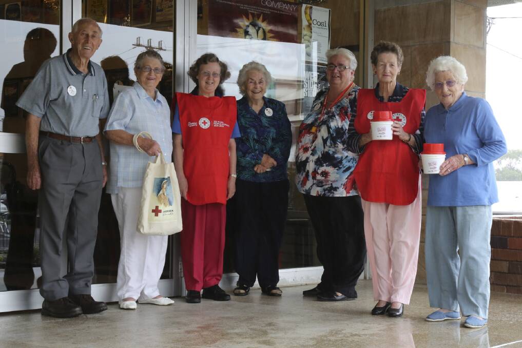 Shellharbour Red Cross members Tom Rhodes, Mary Russell, Margaret Thompson, Audrey Rhodes, Sandra Pearson, Doreen Rea and president Shirley Hodson ready for Red Cross Calling Month this month. Picture: DAVID HALL