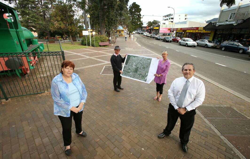 Valerie Hussain, Ray Robinson, Karen Lepard and Paul Boultwood are calling for Corrimal residents to attend the chamber of commerce meeting on Friday night to talk about the need to revitalise the area. Picture: KIRK GILMOUR