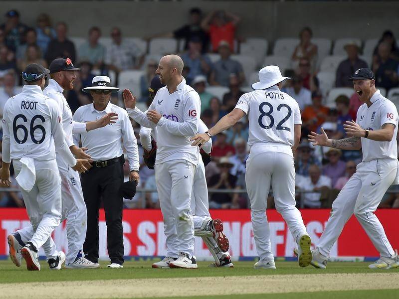 Jack Leach (third from right) celebrates his freaky dismissal of NZ's Henry Nicholls with teammates.