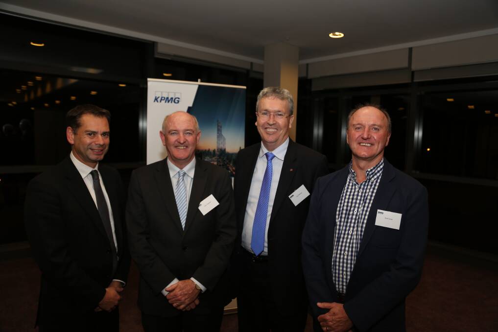 Dignitaries: Warwick Shanks, Peter Fitzgerald, Professor Paul Wellings and Jeff Jones at Mr Fitzgerald's retirement function. It was also a family affair with members of Mr Fitzgerald's family present. Picture: GREG ELLIS