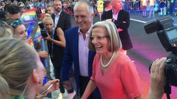 Prime Minister Malcolm Turnbull and wife Lucy greet revellers on Oxford Street.