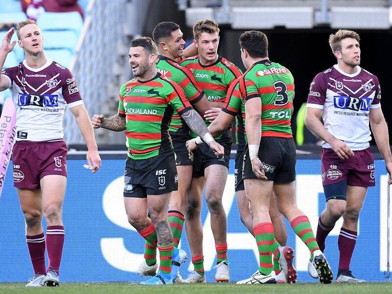 Adam Reynolds (2L) has kicked the decisive field goal in South Sydney's 21-20 NRL win over Manly.